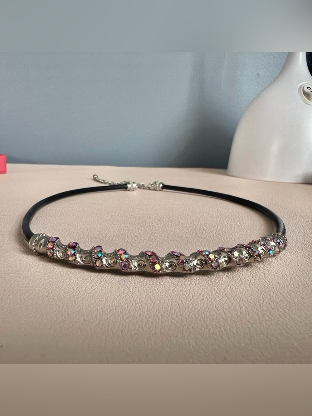 Black choker with silver swirls and multicolored rhinestones